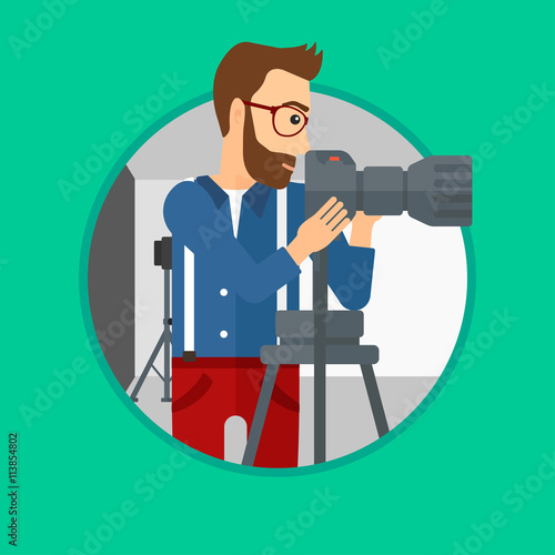 Photographer working with camera on tripod.
