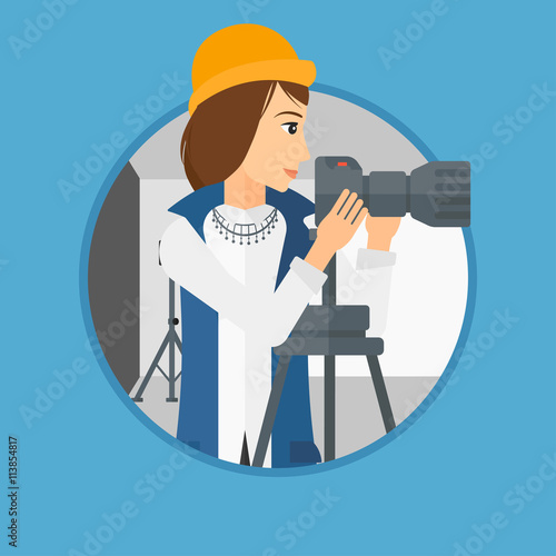 Photographer working with camera on tripod.