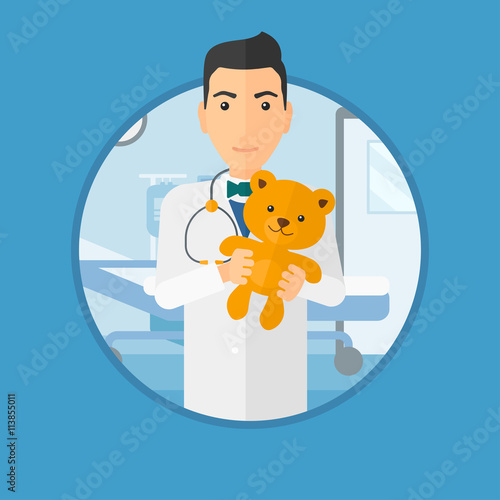 Pediatrician doctor holding teddy bear.