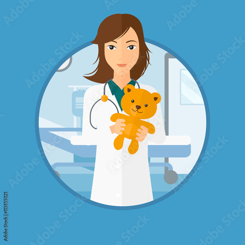 Pediatrician doctor holding teddy bear.
