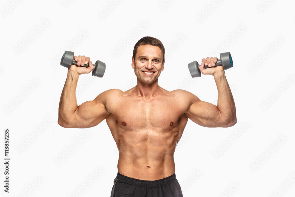 Smiling shirtless male with dumbbells. Smiling shirtless male with dumbbells.