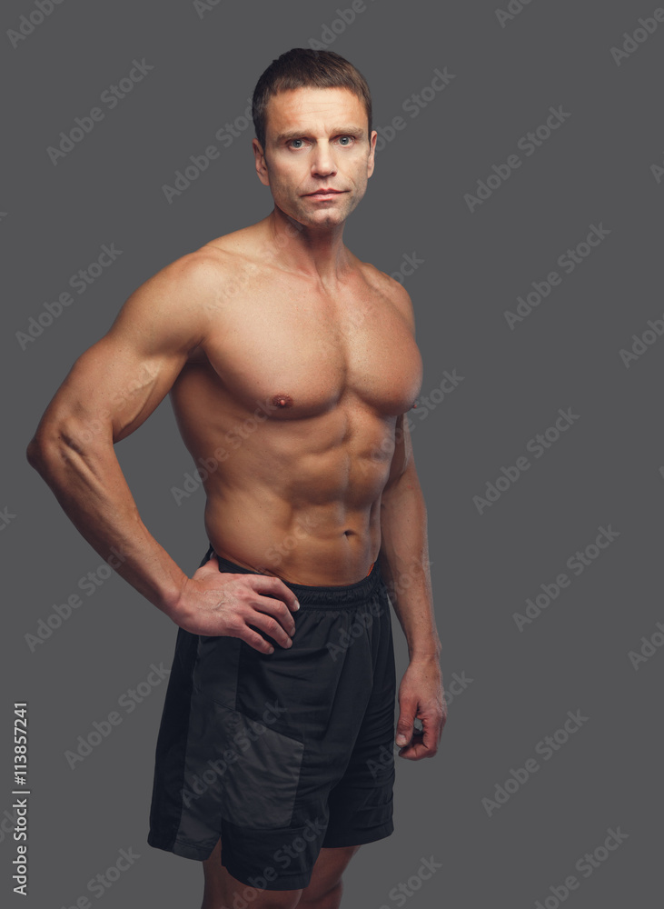 Shirtless male isolated on grey background. Shirtless male isolated on grey background.
