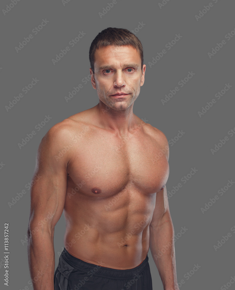 Fototapeta premium Shirtless male isolated on grey background.