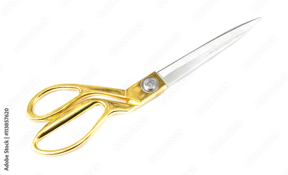 Fototapeta premium A gold tailoring scissors isolated on white background