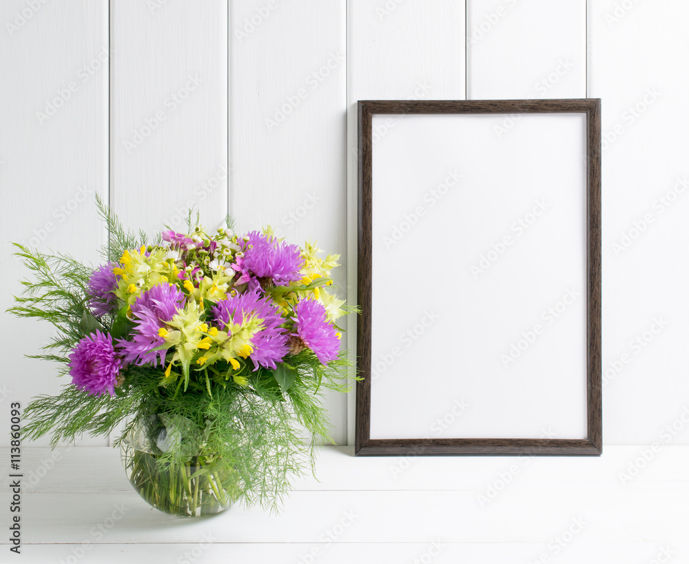Flowers in glass vase with motivational frame Flowers in glass vase with motivational frame