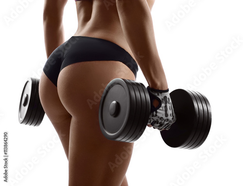 Gym goddess. Cropped shot of a sexy fitness woman lifting weights showing off her perfect buttocks isolated on white copyspace on the side