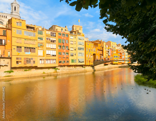 Colorful yellow and orange houses in Girona, Catalonia, Spain.