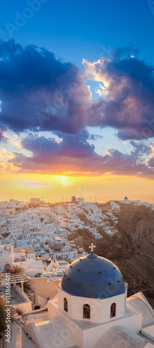 Sunrise against church on Santorini island in Greece