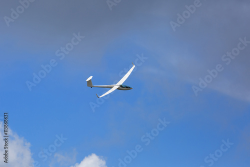 Glider flying in the summer sky.