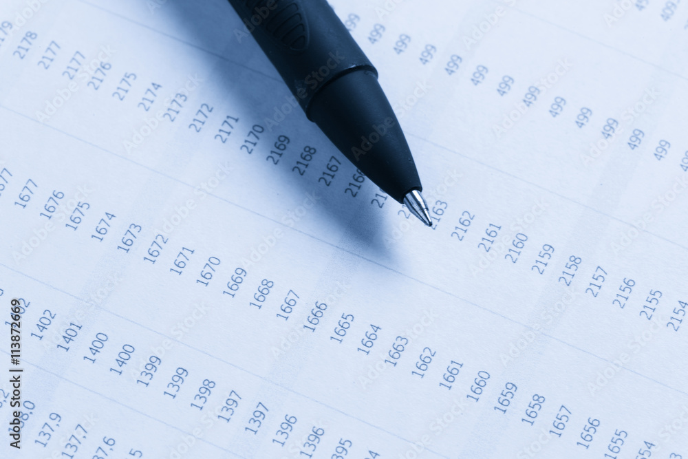 Business performance graph with ballpoint pen Business performance graph with ballpoint pen