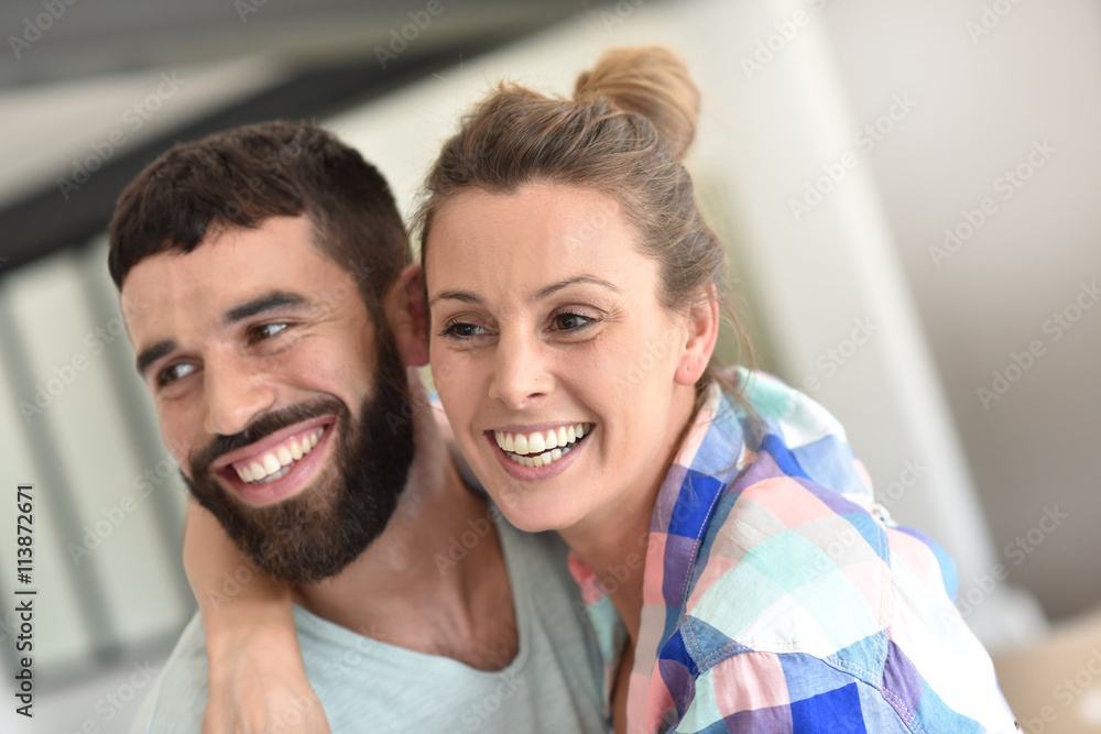 Cheerful hipster couple embracing each other Cheerful hipster couple embracing each other