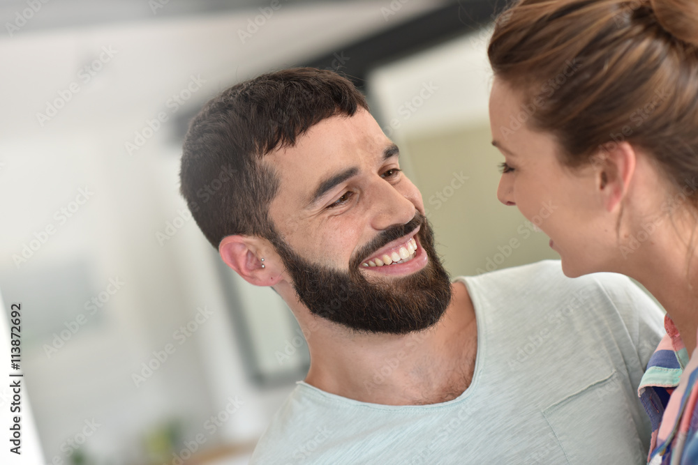 Cheerful hipster couple embracing each other Cheerful hipster couple embracing each other