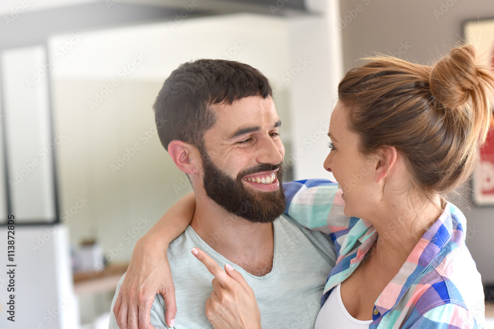 Cheerful hipster couple embracing each other Cheerful hipster couple embracing each other