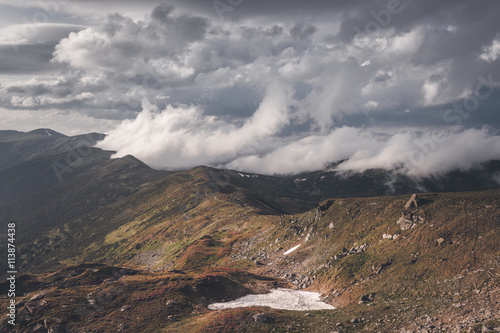 Panorama of stormy mountain hills