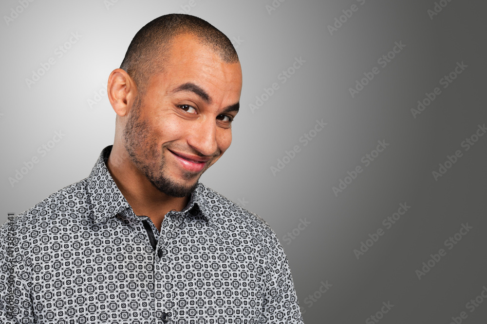 Fototapeta premium Close up portrait of a handsome young man smiling