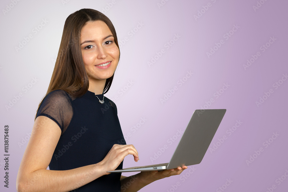 Happy businesswoman standing with laptop Happy businesswoman standing with laptop