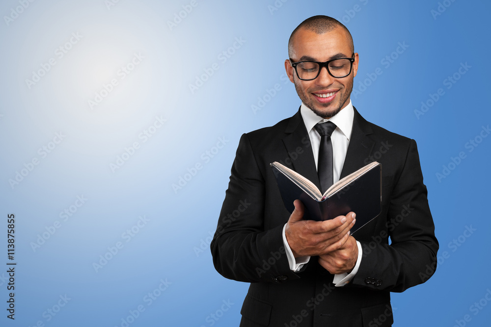 business black man holding a book business black man holding a book