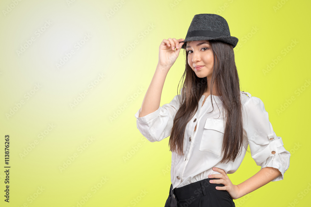 Beautiful young woman wearing summer fedora straw hat posing Beautiful young woman wearing summer fedora straw hat posing