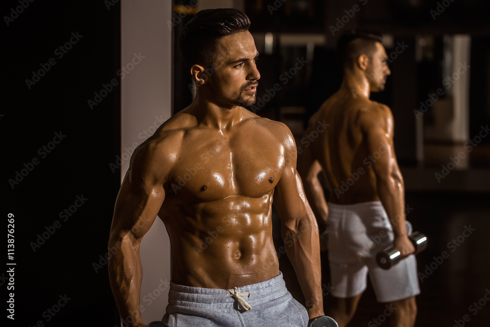 muscular man with dumbbell muscular man with dumbbell