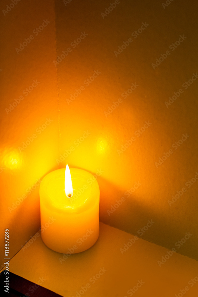 closeup to burning candles in darkness closeup to burning candles in darkness