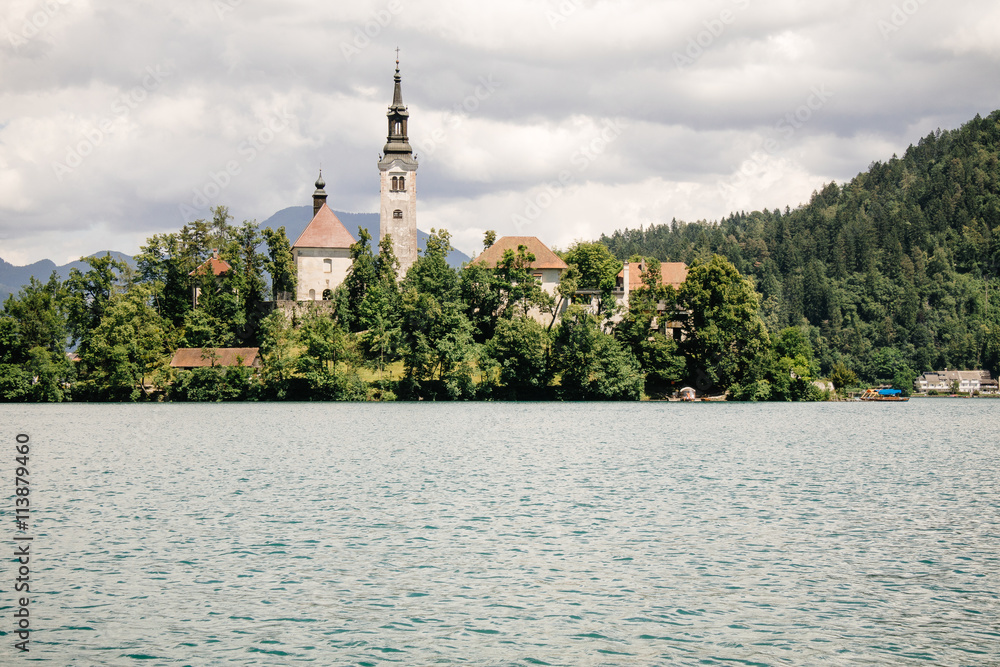 Fototapeta premium Amazing View On Bled Lake, Island,Church And Castle With Mountain Range (Stol, Vrtaca, Begunjscica) In The Background-Bled,Slovenia,Europe