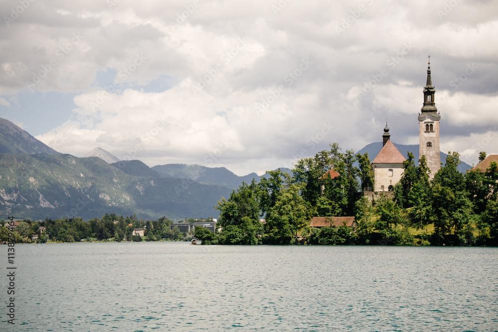 Amazing View On Bled Lake, Island,Church And Castle With Mountain Range (Stol, Vrtaca, Begunjscica) In The Background-Bled,Slovenia,Europe