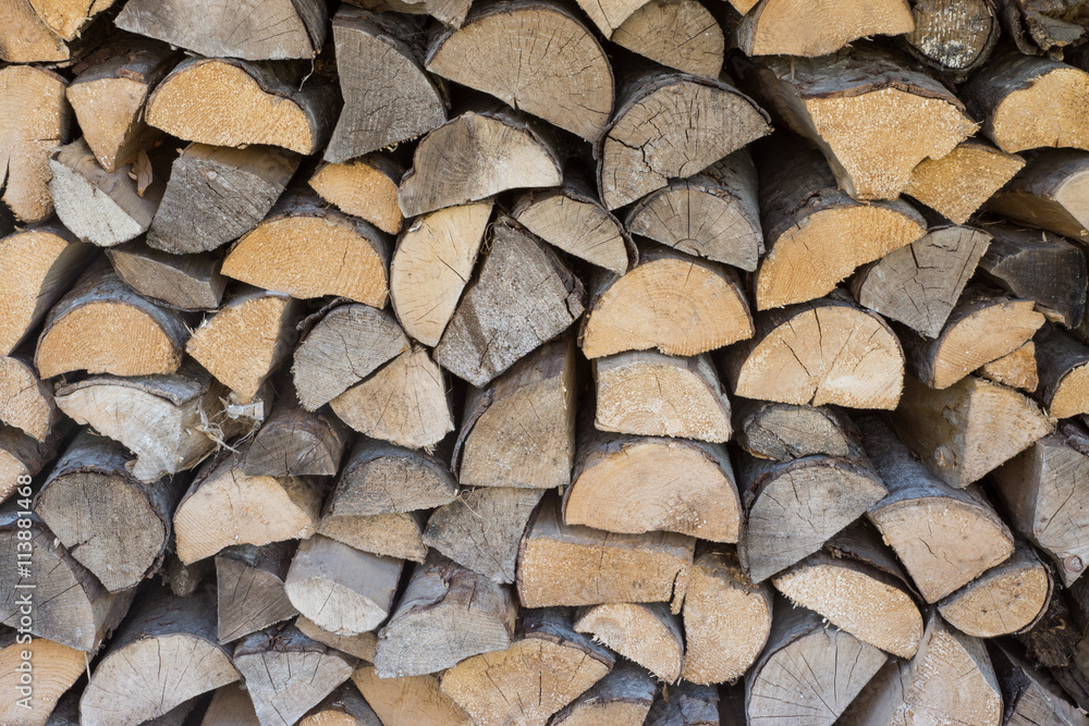 Chopped aspen firewood stacked up in a pile. Chopped aspen firewood stacked up in a pile.