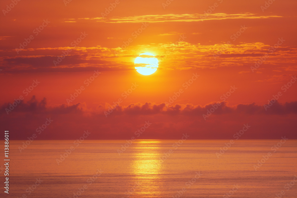 Naklejka premium orange sunset over sea