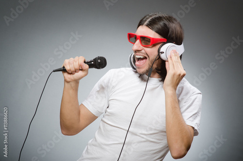 Young man with headphones in DJ concept