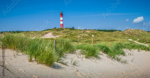 Dune landscape with lighthouse at North Sea