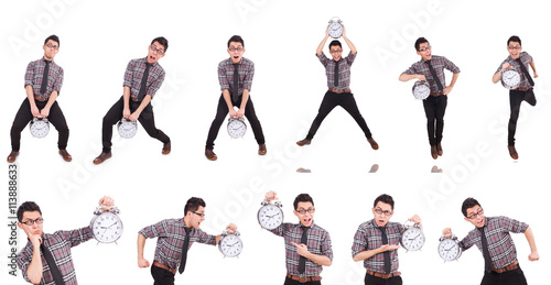 Young man with clock isolated on white