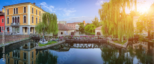 Romantic scene on Lemene river in Portogruaro at sunset, Italy