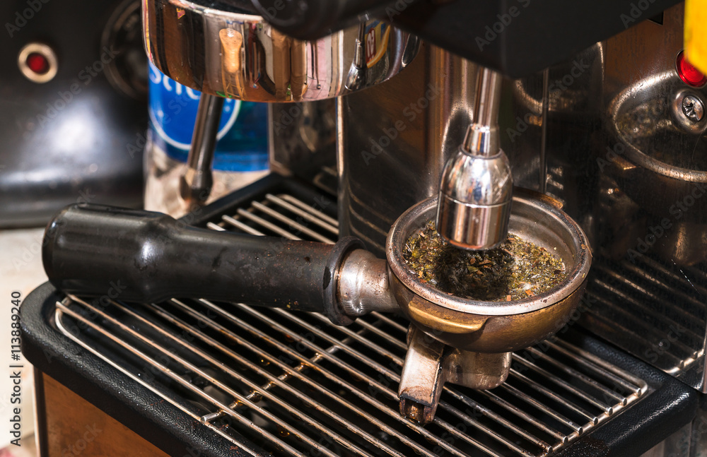 Close-up of espresso pouring from coffee machine. Professional coffee brewing
Close-up of espresso pouring from coffee machine. Professional coffee brewing