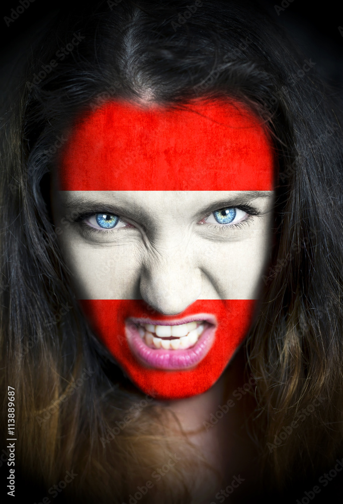 Portrait of a woman with the flag of the Austria painted on her face