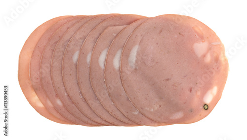 Thin sliced mortadella luncheon meat slices top view isolated on a white background.