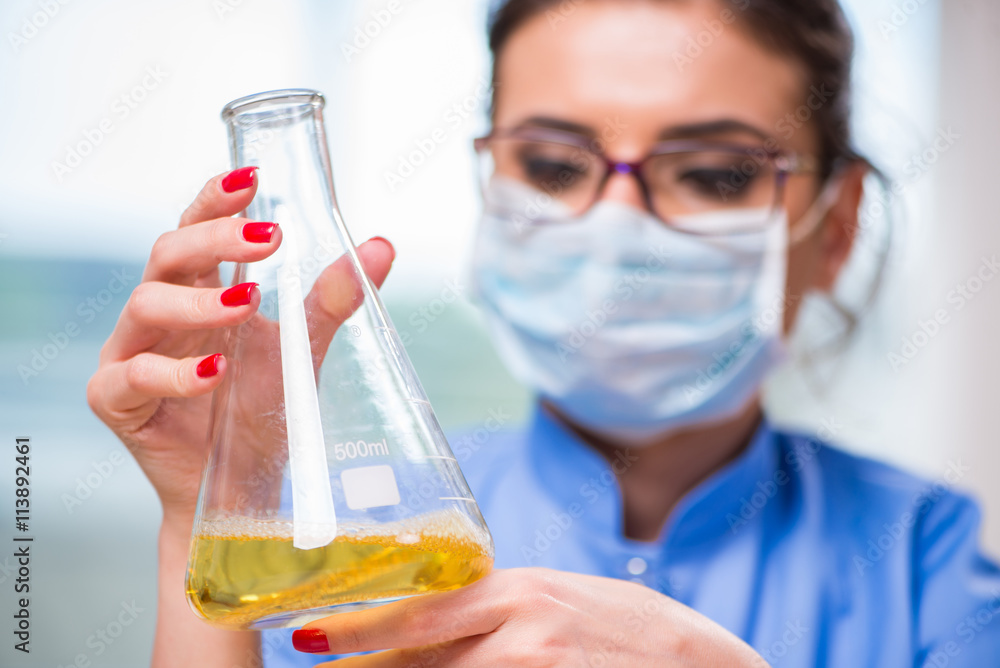 Woman doctor doing chemical tests in laboratory Woman doctor doing chemical tests in laboratory