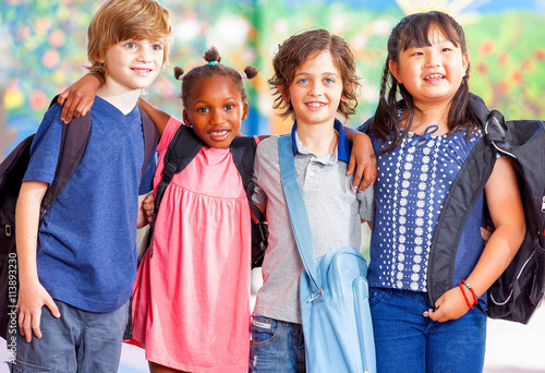 Fotografie Group of kids going to school together