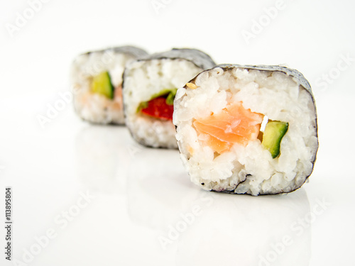 assorted delicious japanese traditional sushi over white 