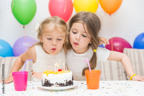 Photography Birthday girl and her friend enjoying a birthday party