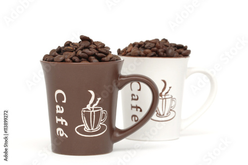 Two cups filled with coffee beans