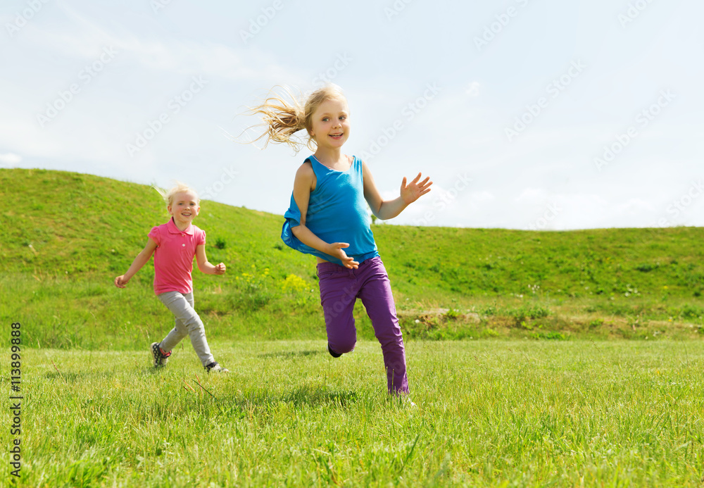 group of happy kids running outdoors group of happy kids running outdoors