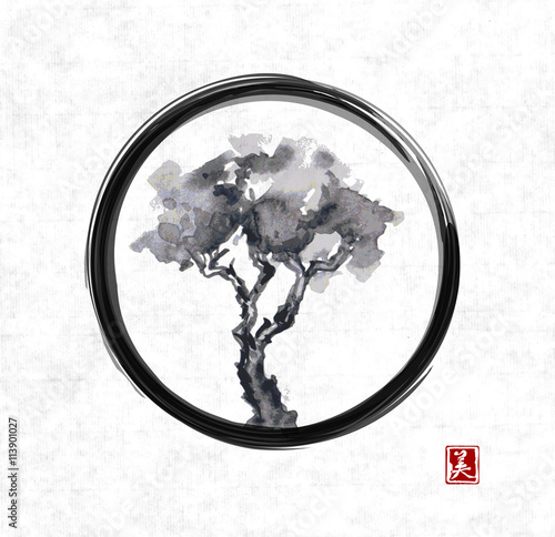 Pine tree in black enso zen circle on rice paper. Traditional Japanese ink painting sumi-e. Contains hieroglyph - beauty.