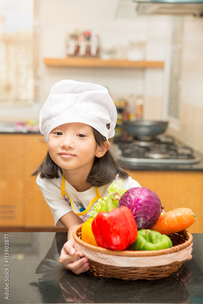 Little asian girl preparing vegetable to making salad Little asian girl preparing vegetable to making salad