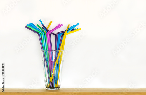 Fotografie Colorful plactic straws in a glass
