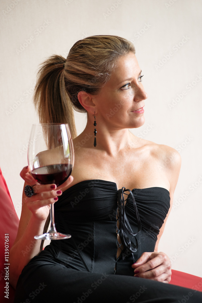 Elegant woman in a black cocktail dress Elegant woman in a black cocktail dress