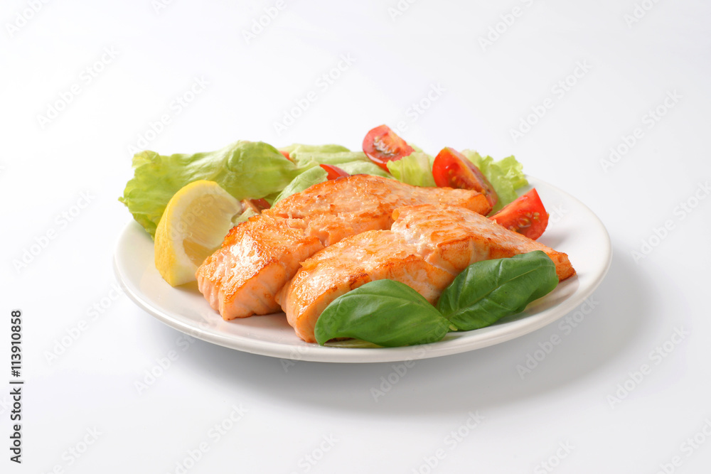 salmon fillets with vegetable garnish salmon fillets with vegetable garnish