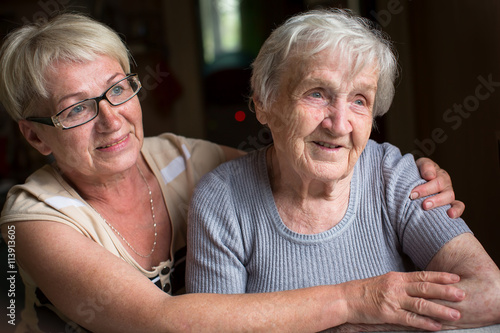 A middle-aged woman with her elderly mother. photo