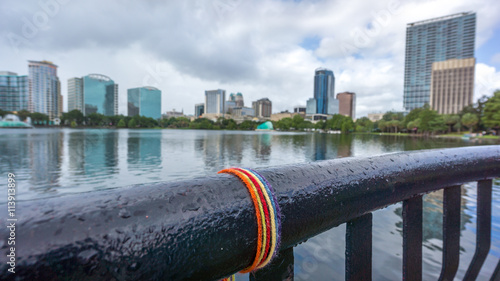 Orlando, FL - June 19, 2016: Makeshift memorial dedicated to the victims of the shooting at Pulse nightclub set up around Lake Eola, Orlando, FL.