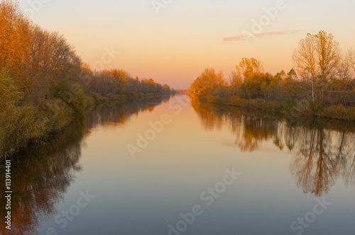 Autumnal landscape with Ukrainian river Orel at sunset time