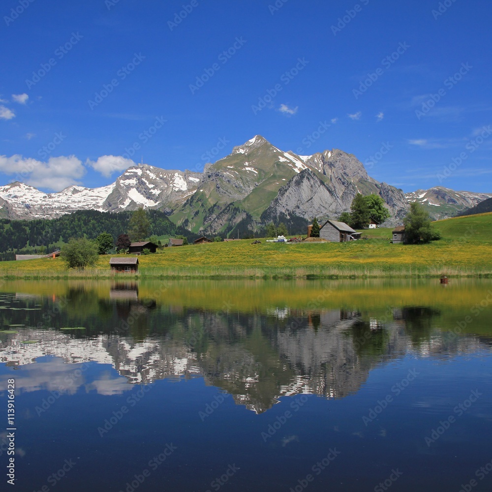 Mt Saentis and Alpstein range mirroring in lake Schwendisee
